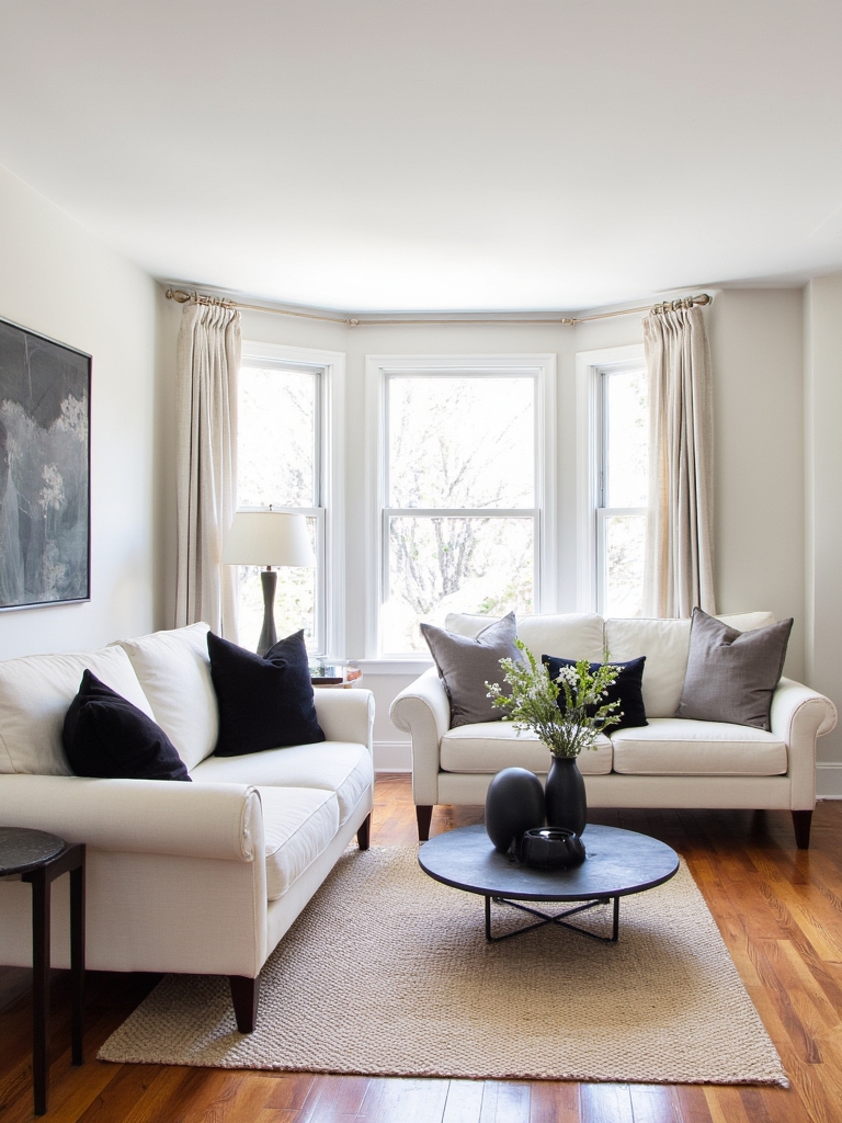 cream sofas black pillows